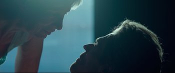 Movie still from “Siberia” (2020), directed by Abel Ferrara – A man and a woman face to face in the dark; Close Up shot, Over the shoulder angle