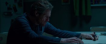 Movie still from “Siberia” (2020), directed by Abel Ferrara – A man sitting in front of a computer keyboard at night; Close Up shot, Over the shoulder angle