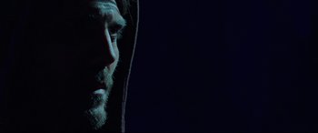 Movie still from “Siberia” (2020), directed by Abel Ferrara – A man with a beard wearing a hooded sweatshirt; Close Up shot, Low angle