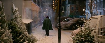 Movie still from “A Boy Called Christmas” (2021), directed by Gil Kenan – A person walking down a street at night; Extreme Wide shot, Over the shoulder angle