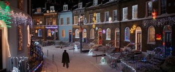Movie still from “A Boy Called Christmas” (2021), directed by Gil Kenan – A man walking down the street in the snow at night; Extreme Wide shot, High angle