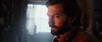 Movie still from “A Boy Called Christmas” (2021), directed by Gil Kenan – A person with a beard looking at the camera; Close Up shot, Low angle