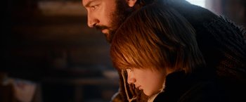 Movie still from “A Boy Called Christmas” (2021), directed by Gil Kenan – A man and a boy are looking at each other; Close Up shot, Low angle