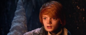 Movie still from “A Boy Called Christmas” (2021), directed by Gil Kenan – A person with short red hair; Close Up shot, Low angle
