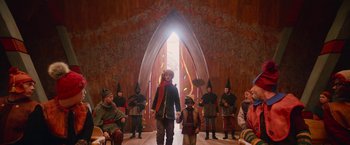 Movie still from “A Boy Called Christmas” (2021), directed by Gil Kenan – A group of people dressed in medieval costumes; Wide shot, Low angle