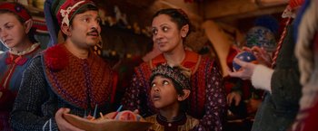 Movie still from “A Boy Called Christmas” (2021), directed by Gil Kenan – A woman and a child are sitting next to each other; Medium shot, Over the shoulder angle