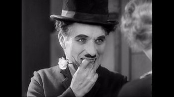 Movie still from “Side by Side” (2012), directed by Christopher Kenneally – A person wearing a top hat; Close Up shot, High angle