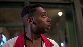 Movie still from “Side by Side” (2012), directed by Christopher Kenneally – A person looking up at something; Close Up shot, Low angle