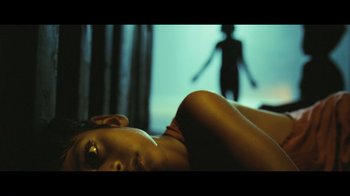 Movie still from “Side by Side” (2012), directed by Christopher Kenneally – A woman laying on the ground in front of a window; Extreme Close Up shot, Low angle