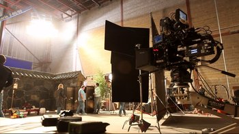 Movie still from “Side by Side” (2012), directed by Christopher Kenneally – Some people are in a room with a camera; Wide shot, Over the shoulder angle