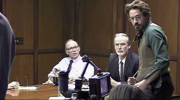 Movie still from “Side by Side” (2012), directed by Christopher Kenneally – A group of men sitting around a table; Medium shot, Over the shoulder angle