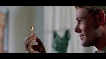 Movie still from “Side by Side” (2012), directed by Christopher Kenneally – A man is holding a lit match in his hand; Close Up shot, Over the shoulder angle