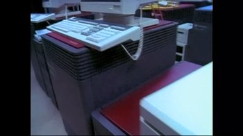 Movie still from “Side by Side” (2012), directed by Christopher Kenneally – A computer desk with a computer keyboard on top of it; Extreme Close Up shot, High angle