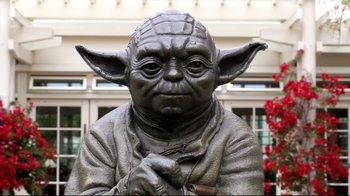 Movie still from “Side by Side” (2012), directed by Christopher Kenneally – A statue of yoda; Close Up shot, Low angle