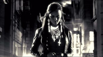 Movie still from “Side by Side” (2012), directed by Christopher Kenneally – A woman in a leather jacket with crosses in her hair; Medium shot, Low angle