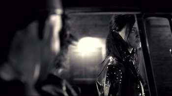 Movie still from “Side by Side” (2012), directed by Christopher Kenneally – A woman in a black leather jacket is looking at a man in a black leather jacket; Close Up shot, Over the shoulder angle