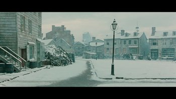 Movie still from “Side by Side” (2012), directed by Christopher Kenneally – A street light in the middle of a snow covered street; Extreme Wide shot, High angle