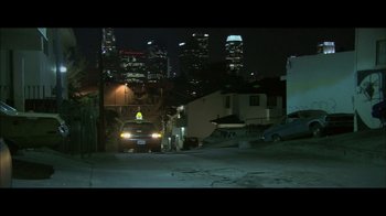 Movie still from “Side by Side” (2012), directed by Christopher Kenneally – A car parked on the side of the road at night; Extreme Wide shot, High angle