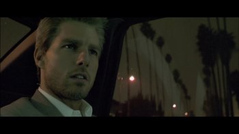 Movie still from “Side by Side” (2012), directed by Christopher Kenneally – A person in a car at night; Close Up shot, Low angle