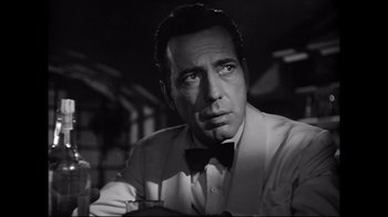 Movie still from “Side by Side” (2012), directed by Christopher Kenneally – Black and white photograph of a man in a bow tie; Close Up shot, Low angle