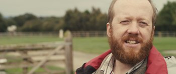 Movie still from “Sightseers” (2012), directed by Ben Wheatley – A person with a beard; Close Up shot, Over the shoulder angle