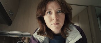 Movie still from “Sightseers” (2012), directed by Ben Wheatley – A person wearing a jacket; Close Up shot, Low angle