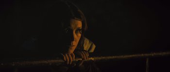 Movie still from “Sightseers” (2012), directed by Ben Wheatley – A woman looking over a railing at night; Close Up shot, Low angle