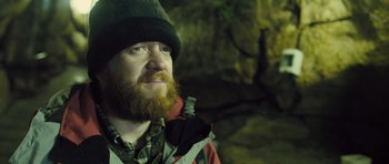 Movie still from “Sightseers” (2012), directed by Ben Wheatley – A man with a beard wearing a hat and jacket; Close Up shot, Low angle