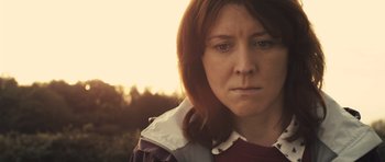 Movie still from “Sightseers” (2012), directed by Ben Wheatley – A person wearing a jacket; Close Up shot, Low angle