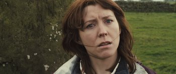 Movie still from “Sightseers” (2012), directed by Ben Wheatley – A person wearing a headset; Close Up shot, Low angle