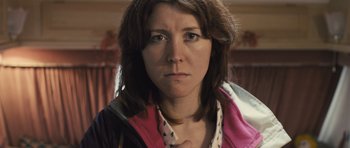 Movie still from “Sightseers” (2012), directed by Ben Wheatley – A person wearing a jacket; Close Up shot, Low angle