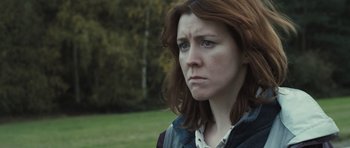 Movie still from “Sightseers” (2012), directed by Ben Wheatley – A person with long red hair; Close Up shot, Over the shoulder angle