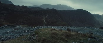 Movie still from “Sightseers” (2012), directed by Ben Wheatley – A view of a mountain range from a hill side; Extreme Wide shot, High angle