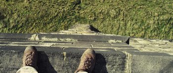 Movie still from “Sightseers” (2012), directed by Ben Wheatley – A person's foot is on a set of steps; Extreme Close Up shot, Overhead angle