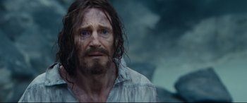 Movie still from “Silence” (2016), directed by Martin Scorsese – A person with long hair and a beard; Close Up shot, Low angle