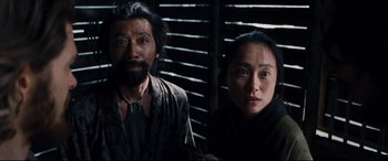 Movie still from “Silence” (2016), directed by Martin Scorsese – A man and a woman standing next to each other; Close Up shot, Low angle