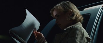 Movie still from “Silent Hill” (2006), directed by Christophe Gans – A woman is looking at a sheet of paper; Close Up shot, High angle
