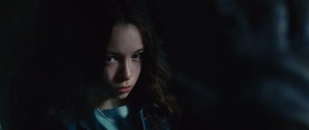 Movie still from “Silent Hill” (2006), directed by Christophe Gans – A young girl is staring into the camera; Close Up shot, High angle