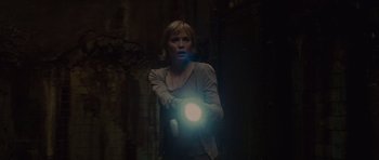 Movie still from “Silent Hill” (2006), directed by Christophe Gans – A woman holding a flashlight in a dark room; Medium shot, Low angle