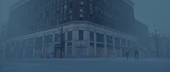 Movie still from “Silent Hill” (2006), directed by Christophe Gans – An empty street in front of an abandoned building; Extreme Wide shot, Low angle