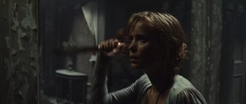 Movie still from “Silent Hill” (2006), directed by Christophe Gans – A woman holding a knife in a dark room; Close Up shot, Over the shoulder angle