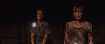 Movie still from “Silent Hill” (2006), directed by Christophe Gans – Two women are standing next to each other; Medium shot, Low angle