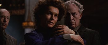 Movie still from “Silent Hill” (2006), directed by Christophe Gans – An older man and a younger woman looking at the camera; Close Up shot, Low angle