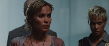 Movie still from “Silent Hill” (2006), directed by Christophe Gans – A person with blood all over her face; Close Up shot, Over the shoulder angle