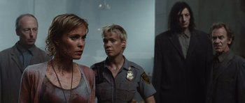 Movie still from “Silent Hill” (2006), directed by Christophe Gans – Two women are standing next to each other in a room; Medium shot, Over the shoulder angle