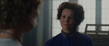 Movie still from “Silent Hill” (2006), directed by Christophe Gans – A woman in a blue shirt is looking at the camera; Close Up shot, Over the shoulder angle