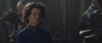 Movie still from “Silent Hill” (2006), directed by Christophe Gans – A woman in a dark room looking at the camera; Close Up shot, Over the shoulder angle