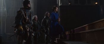 Movie still from “Silent Hill” (2006), directed by Christophe Gans – A group of people standing on steps in a dark room; Wide shot, Low angle