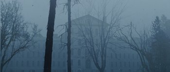 Movie still from “Silent Hill” (2006), directed by Christophe Gans – A building in the middle of a foggy day; Extreme Wide shot, Low angle