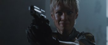 Movie still from “Silent Hill” (2006), directed by Christophe Gans – A person holding a gun; Close Up shot, Low angle